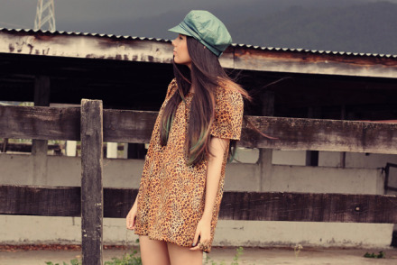 Vintage newsboy cap and leopard print dress